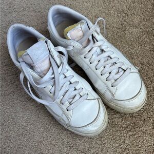 Nike Women’s White Leather Low-Top Sneakers with Subtle Yellow Tongue Detail